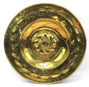 An antique style brass alms dish.