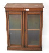 An Edwardian walnut tabletop display cabinet. The glazed doors enclosing a single shelf, L51.