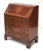 A 20th century mahogany veneered bureau.