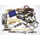 An assortment of costume jewellery and wristwatches.