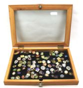 A display case containing badges relating to lawn bowls.