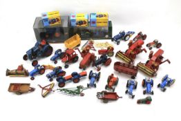 An assortment of diecast and toy tractors.