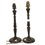 A pair of turned wooden table lamps on circular bases. H40cm.