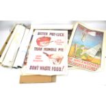 A collection of reproduction military posters.
