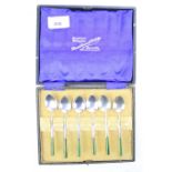 A set of six white metal silver teaspoons. Stamped 'Silver', with jade handles.