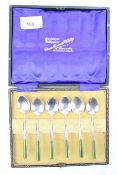 A set of six white metal silver teaspoons. Stamped 'Silver', with jade handles.