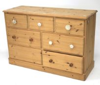 A contemporary pine chest of drawers.