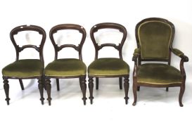 A set of three Victorian mahogany balloon back chairs and a similar elbow chair.