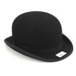 A vintage black felt bowler hat.
