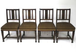 A set of four Arts and Crafts style dining chairs.