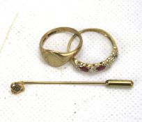 A 9ct gold signet ring, a yellow metal ring and a 9ct gold tie pin.