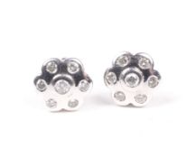 A pair of 18ct white gold and diamond cluster stud earrings.