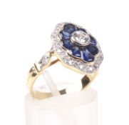 A modern sapphire and diamond shaped-oval cluster ring,