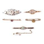 A group of for Victorian and later gold bar brooches and a silver and gilt brooch.