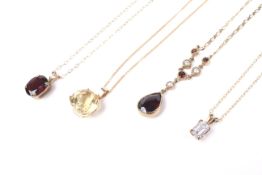 Four gold and gem pendants and chain.
