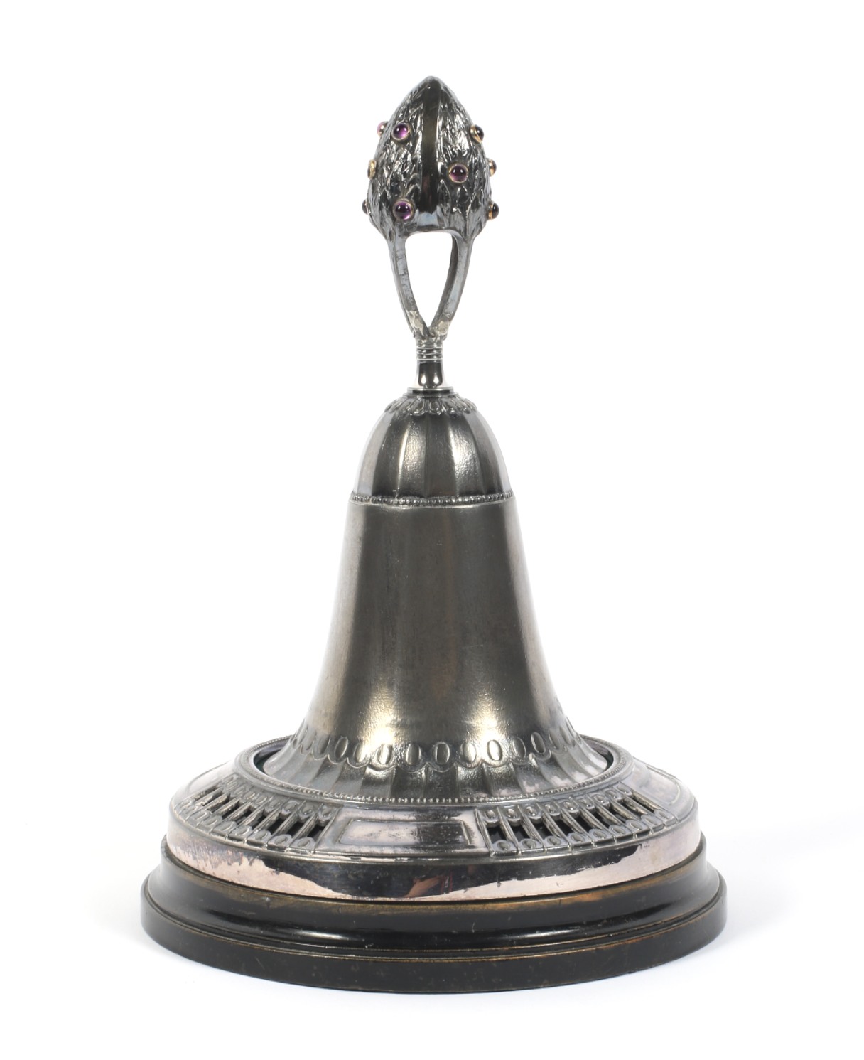 A Continental Art Nouveau paste mounted pewter table bell on ebonised stand.