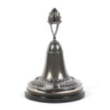 A Continental Art Nouveau paste mounted pewter table bell on ebonised stand.