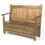 A 19th century pine settle.