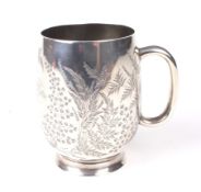 A Victorian silver engraved baluster tankard.