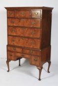 An Old reproduction elm veneered Queen Anne style chest-on-stand.