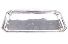 An Egyptian silver pen tray. Of canted rectangular form, cast with foliate border,