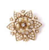 A late Victorian gold, half-pearl and diamond flower-head cluster brooch.