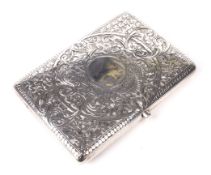 A fine Victorian silver purse with fitted leather interior.