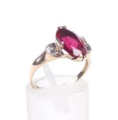A synthetic-ruby and diamond dress ring.