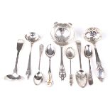 An assortment of silver teaspoons, two sauce ladles and two Victorian sugar sifters.