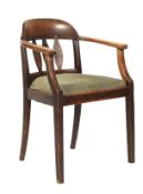 An Oak arts and crafts desk chair. With curved back supported by three splats, with drop in seat.