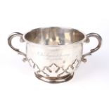 A silver two-handled cup.