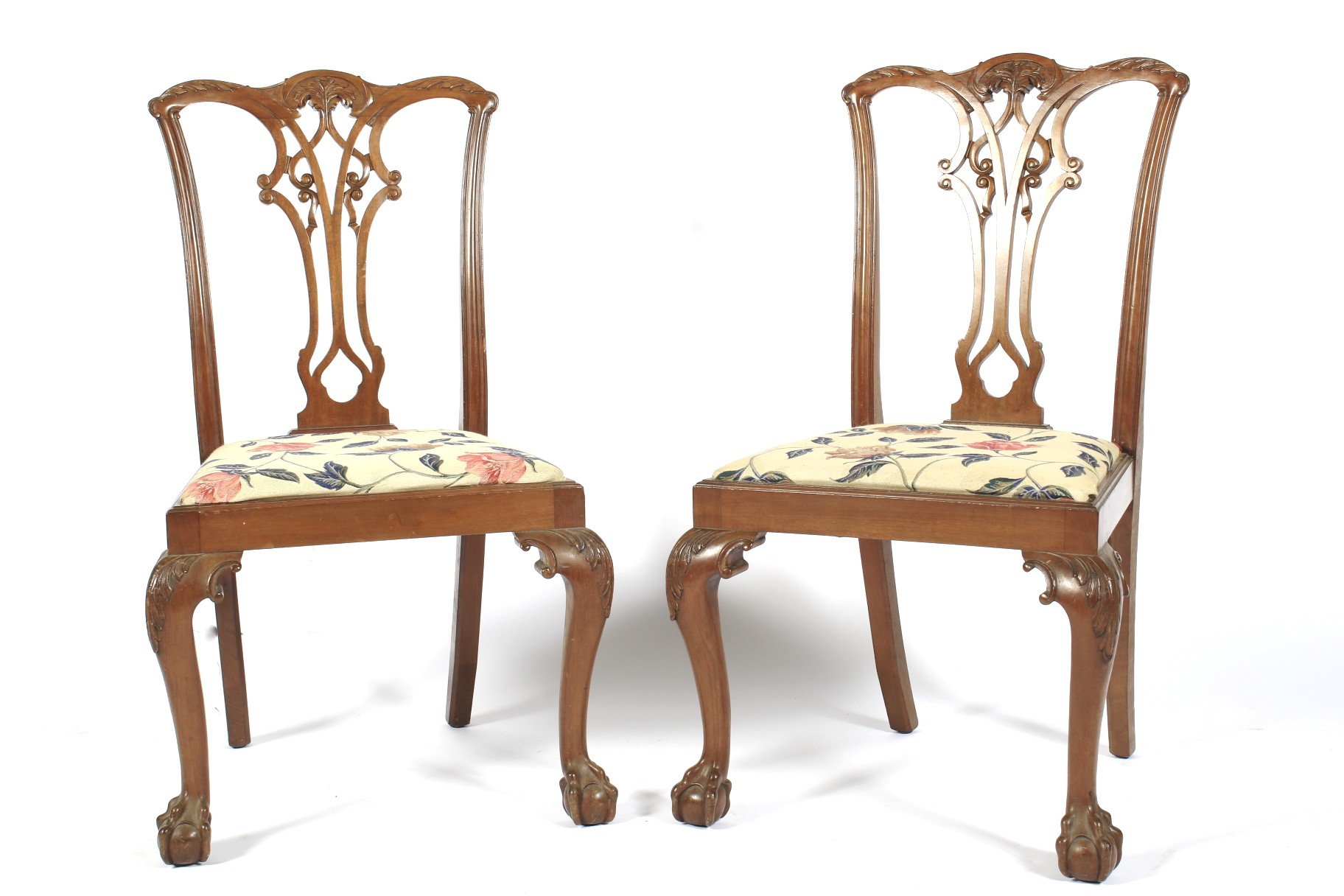 A Pair of mahogany Chippendale style dining chairs.