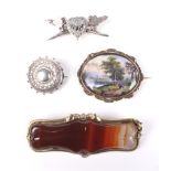 A group of four Victorian and later brooches.