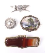 A group of four Victorian and later brooches.