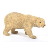 A Continental biscuit pottery model of a polar bear.