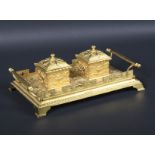 A Victorian Gothic style gilt brass twin inkstand.