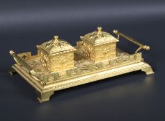 A Victorian Gothic style gilt brass twin inkstand.