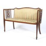 An Edwardian mahogany and string inlaid settee.