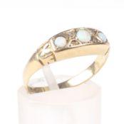 An early 20th century 18ct gold and opal three stone gypsy-type ring.