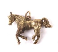 9ct charm in the form of a trotting horse