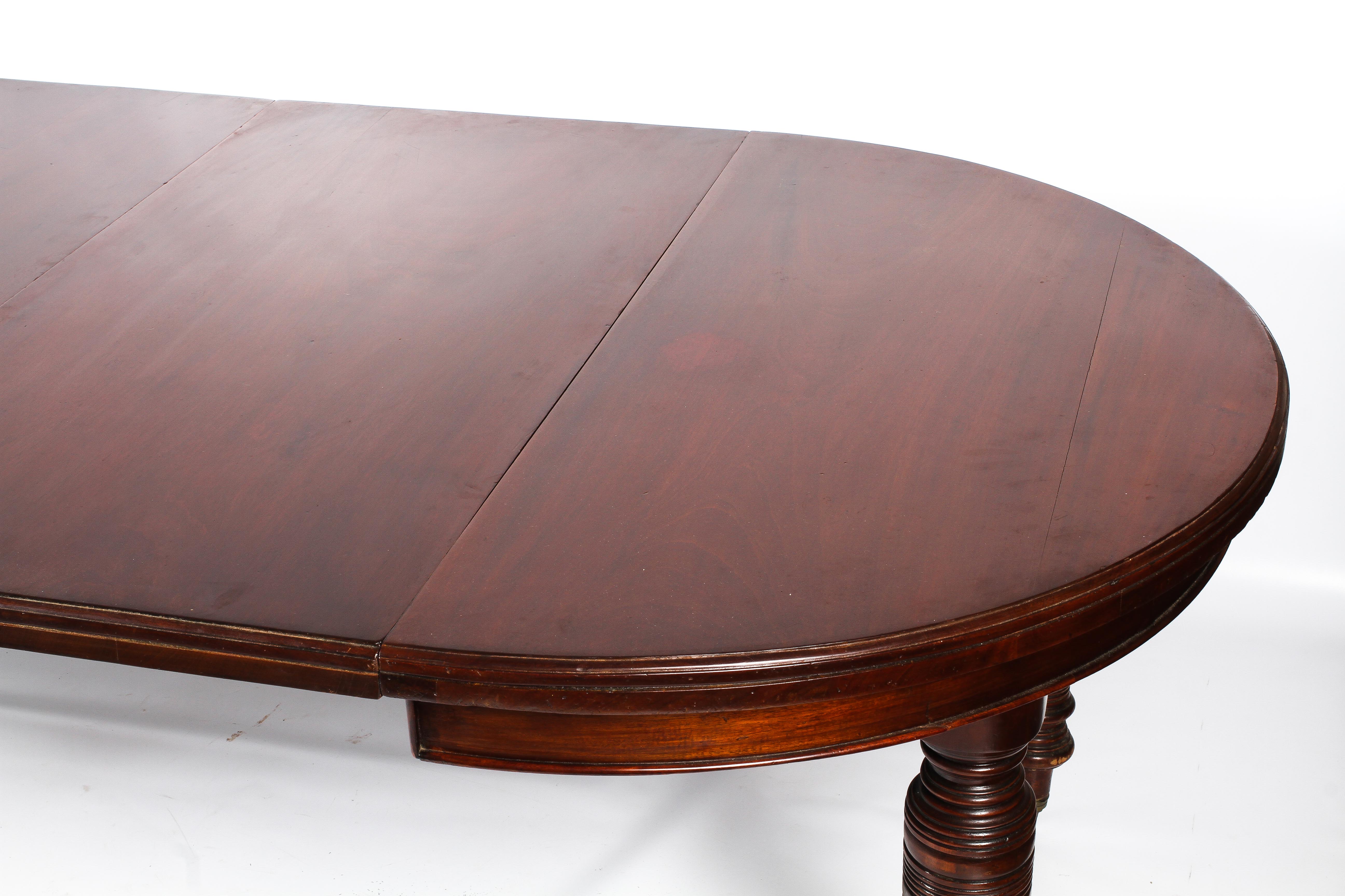 A Regency oval mahogany extending dining table. - Image 5 of 5
