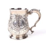 A Victorian silver embossed baluster tankard.