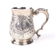 A Victorian silver embossed baluster tankard.