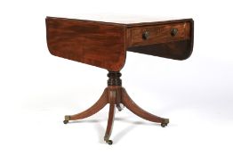 A 19th century mahogany pedestal Pembroke table.