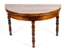 A 19th century French walnut demi-lune folding dining table.