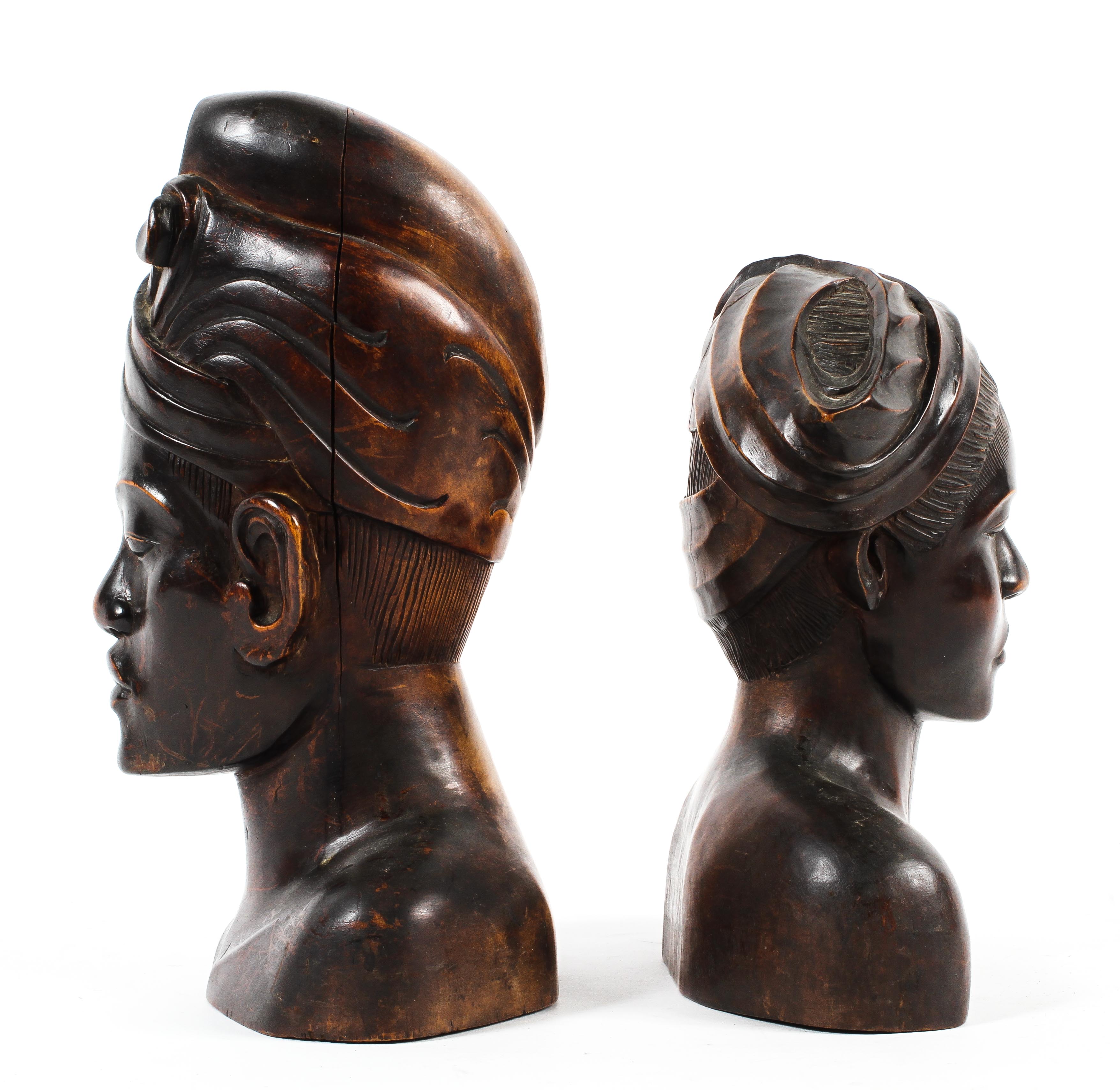 An early 20th century pair of carved hardwood busts of a Balinese man and woman. - Image 2 of 2