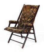 A Victorian folding upholstered steamer-type chair.