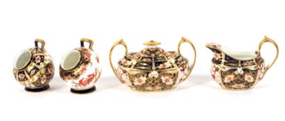 Two Royal Crown Derby imari pattern salt pigs,