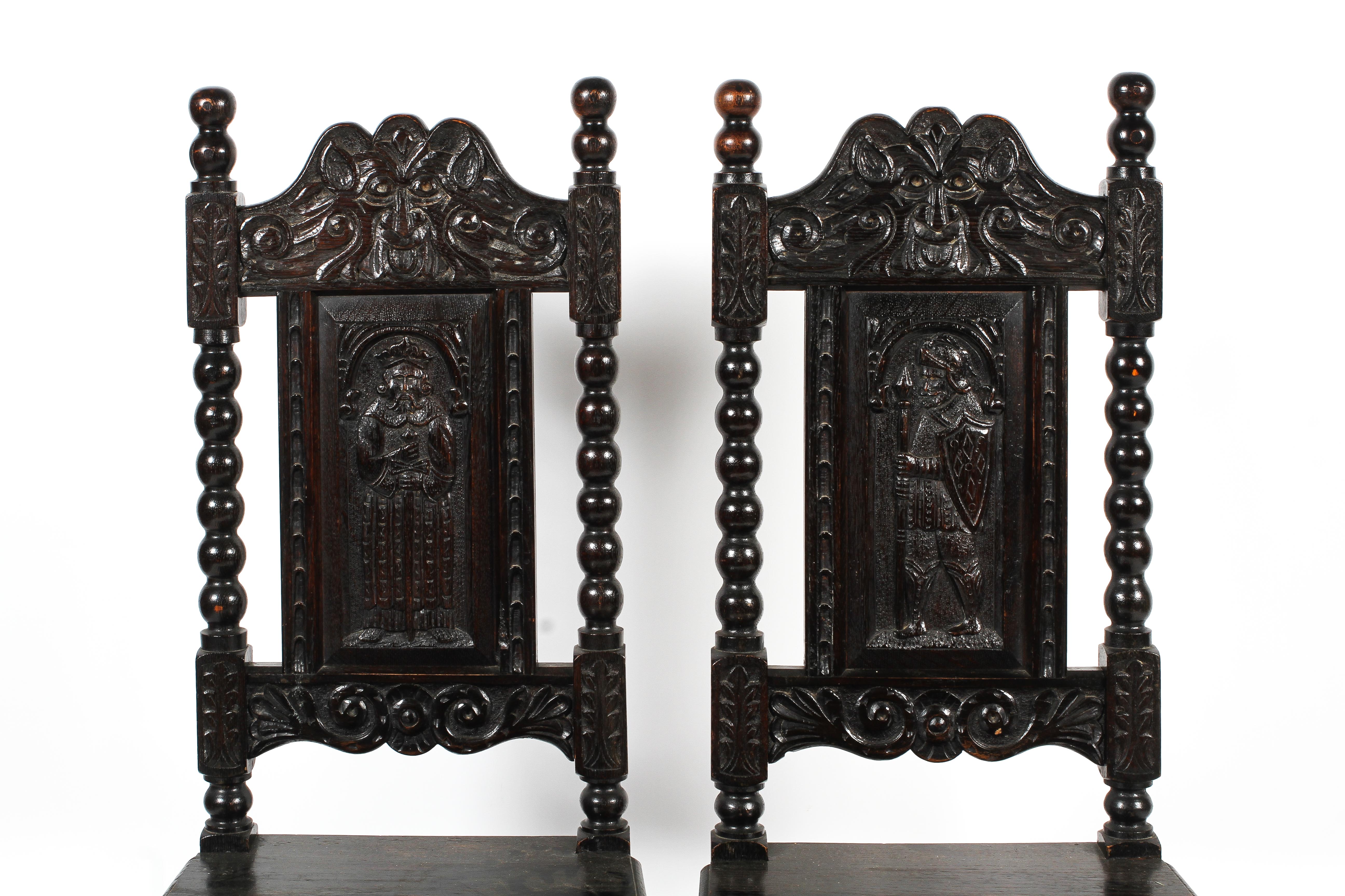 A pair of early 20th century ebonised carved Jacobean style hall chairs. - Image 3 of 3
