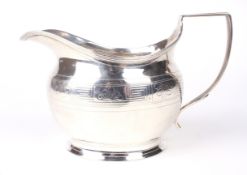 A George III silver cream jug.